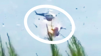 Firefighting helicopters operating over a wildfire in Greece before a fatal mid-air collision.